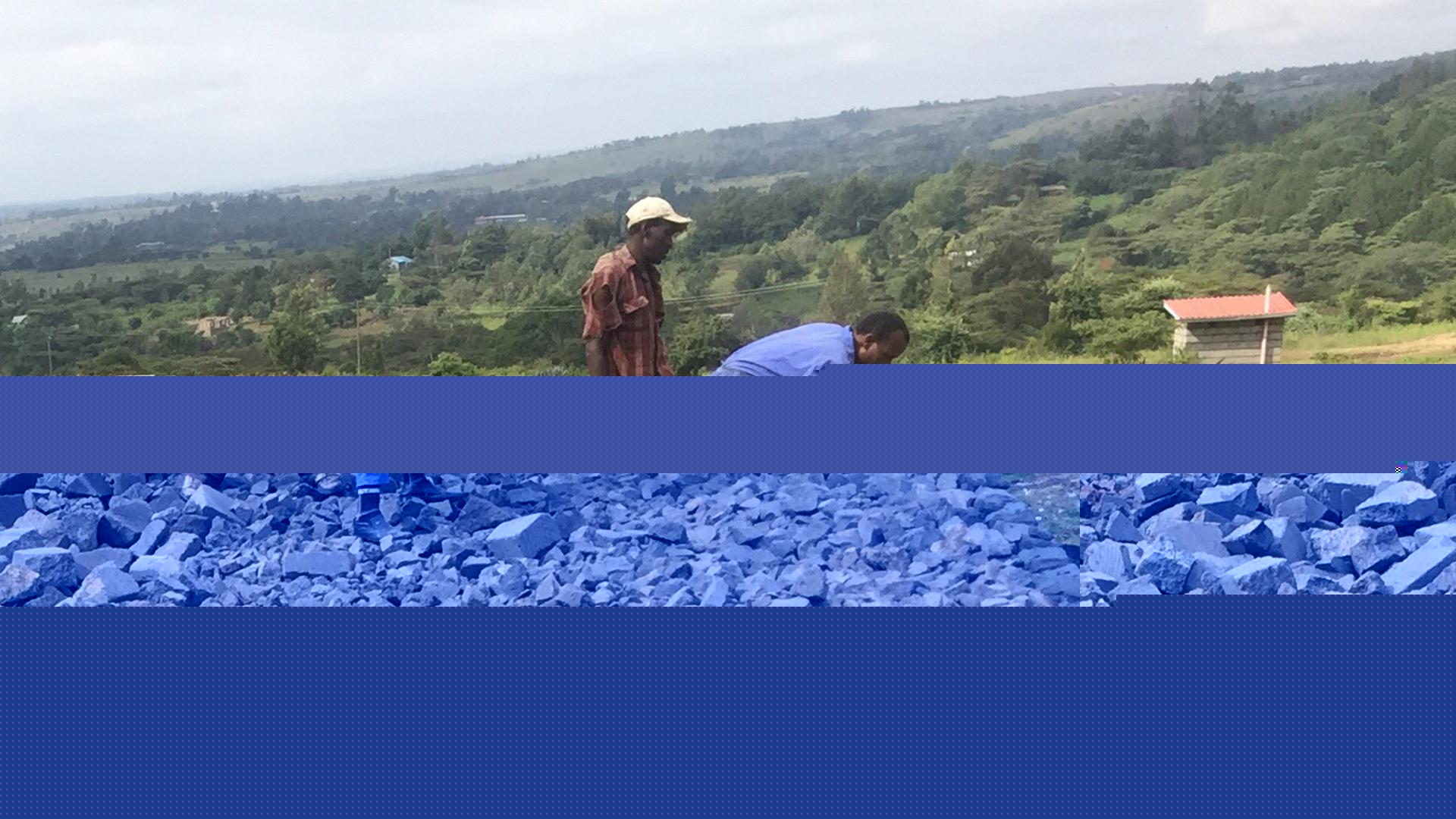 Workers build a library in Kiserian, Kenya