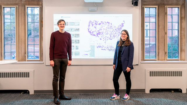 Taylor Arnold and Lauren Tilton in front of a map from the Photogrammar project
