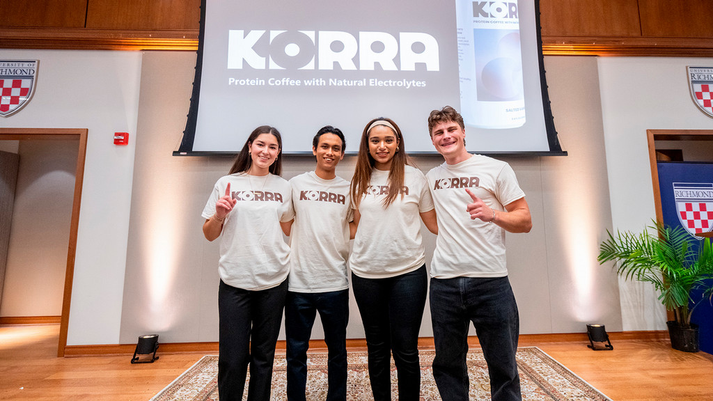 Four University of Richmond students pose in front of their winning product