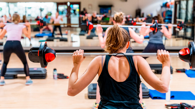 Women using barbells in Weinstein Recreation Center