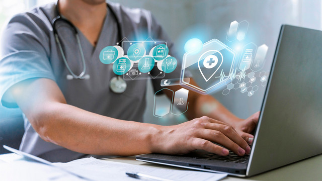 Cropped image of a doctor using a computer