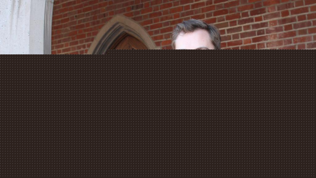 Matt Barnes standing by arch