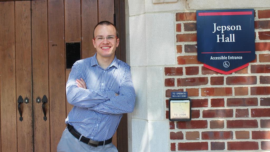 Dr. Vladimir Chlouba standing by an entrance to Jepson Hall