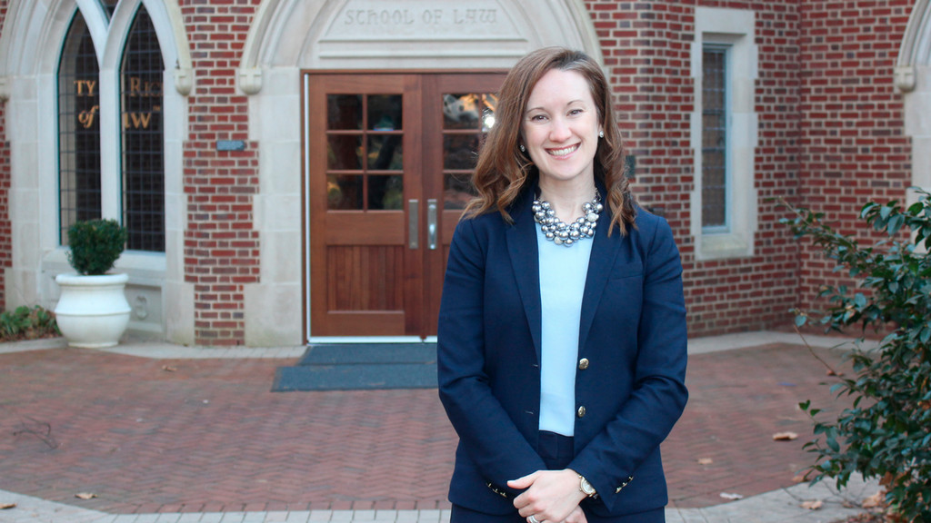 Alum Katherine Groover standing by the Law School entrance