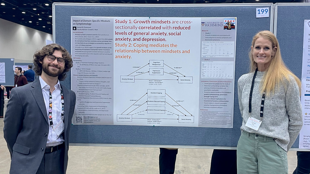 Senior Samuel Chanenson, left, presenting his research at the Society for Personality and Social Psychology Convention, accompanied by his faculty mentor, Dr. Crystal Hoyt