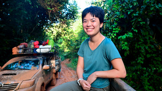 Senior Jasmine Lin in the back of a pick-up truck in the Amazon rainforest