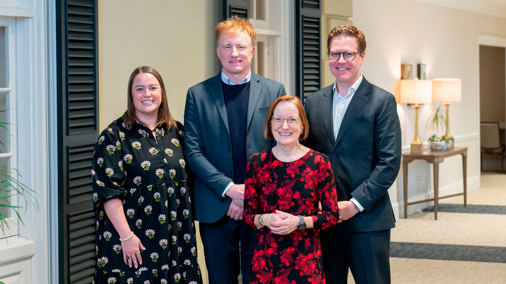 2025 Jepson School Alumni Award recipients Jessica Thompson, '15, Patrick Rucker, '96, and Kenneth Kraper, '05, pose with Dean Sandra Peart in the Jepson Alumni Center.