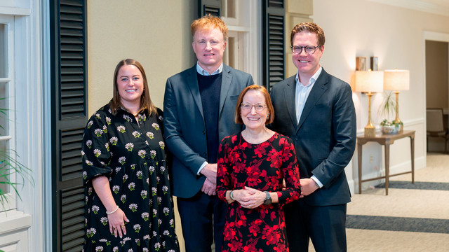 2025 Jepson School Alumni Award recipients Jessica Thompson, '15, Patrick Rucker, '96, and Kenneth Kraper, '05, pose with Dean Sandra Peart in the Jepson Alumni Center.
