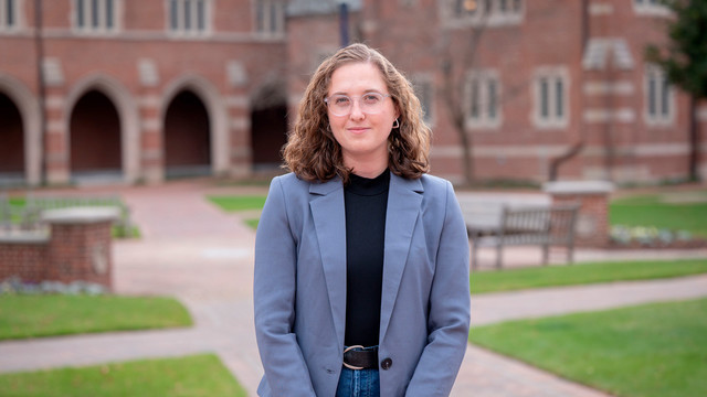 Senior Kate Chasin on Stern Plaza in front of the Humanities Building