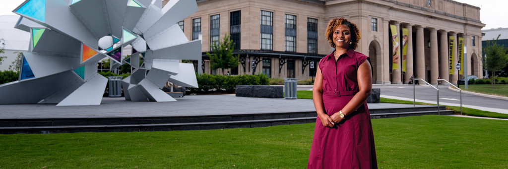 Danielle Stokes poses in front of the Virginia Science Museum.
