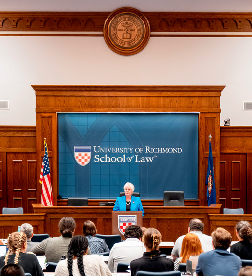 Dean Wendy Perdue speaking in the moot court room.