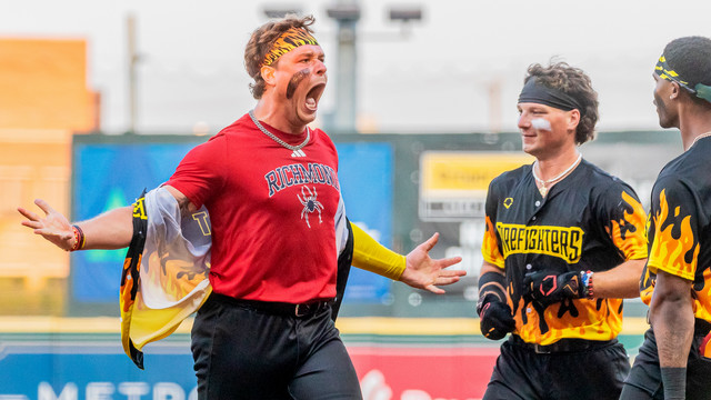 Tyler Rigot, GC’25, celebrating with teammates at the end of a Banana Ball game in Richmond