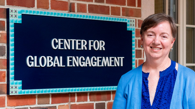 Martha Merritt in front of the Center for Global Engagement