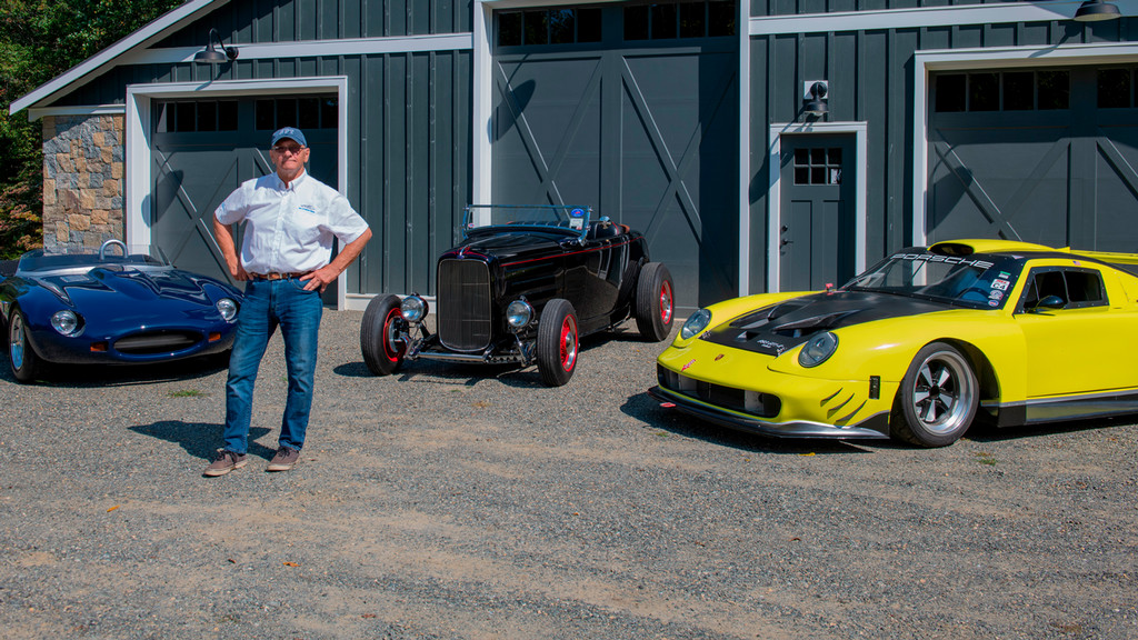 Dennis Kazmerowski, ’69, stands with three of his cars.