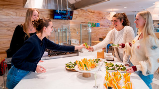 People at the demo kitchen testing out Envee dressing.
