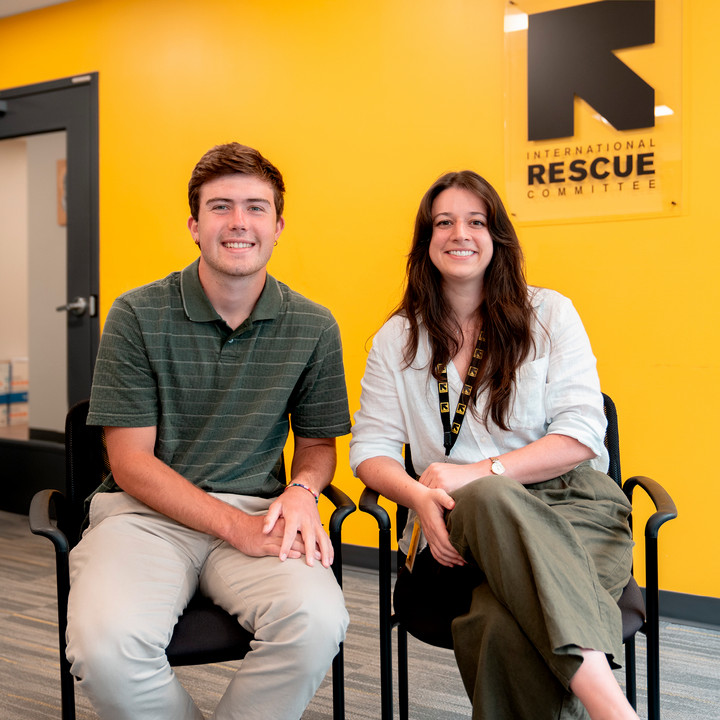 A photo of Eric Harshiner and Abby Photiadis in the offices of the International Rescue Committee.