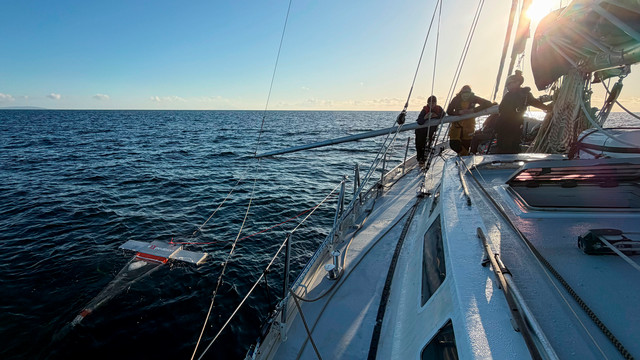 A photo of a large sailboat on the ocean.
