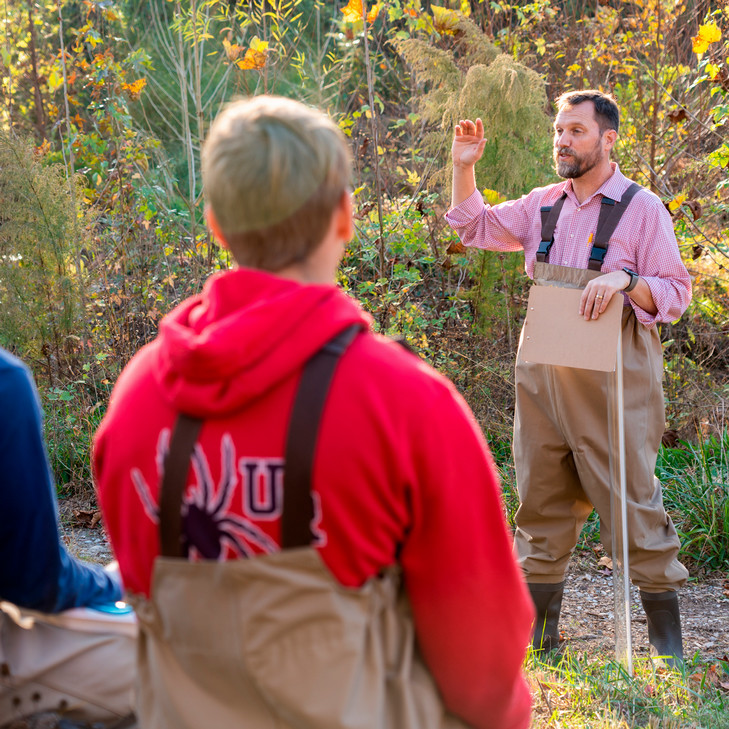 A photo of Rob Andrejewski, Director of Sustainability at the University of Richmond, talking to students in a class held in the eco-corridor.