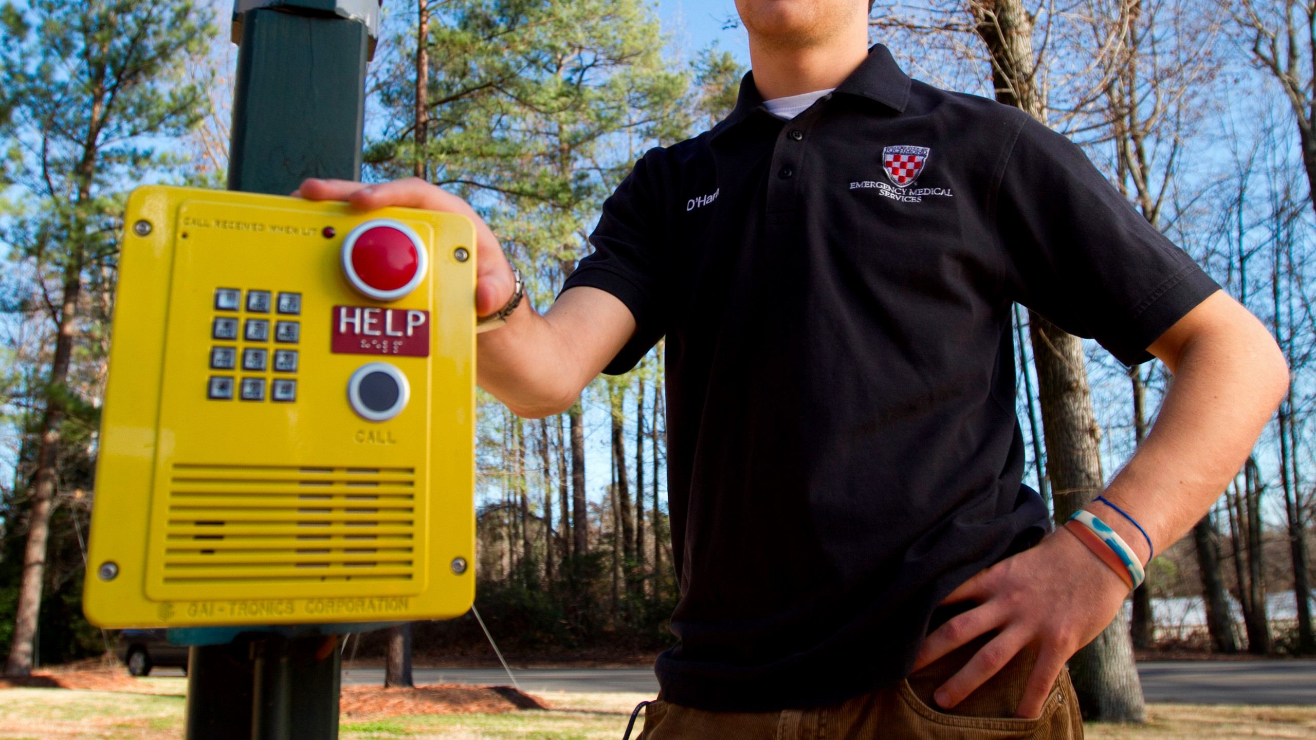 A photo of a yellow emergency call box.