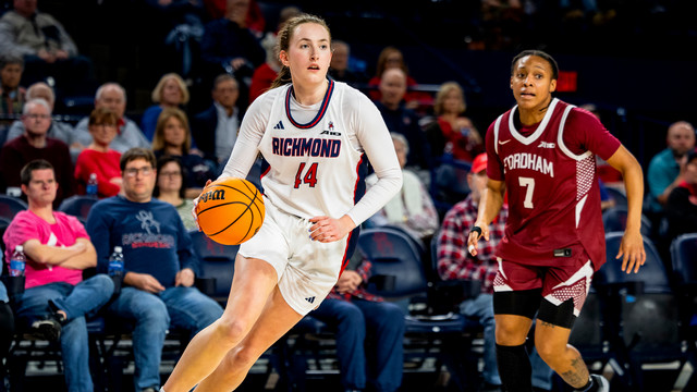 A photo of  Maggie Doogan on the basketball court against Fordham.