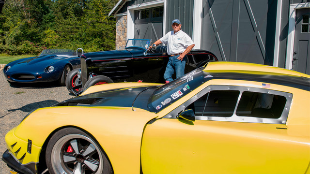 Dennis “Kaz” Kazmerowski stands with three of his cars.