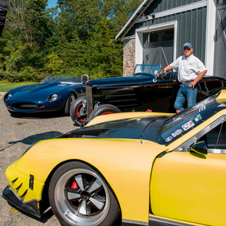 Dennis “Kaz” Kazmerowski stands with three of his cars.