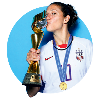 U.S. Women's national soccer team captain Carli Lloyd kisses the world cup trophy.