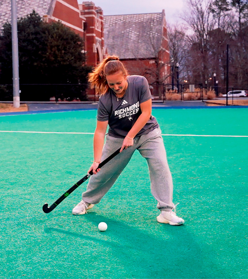 Marisa Snee get a good hit on the field hockey ball.