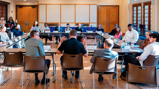 A guest speaker leads a discussion at the McDowell Institute lecture series