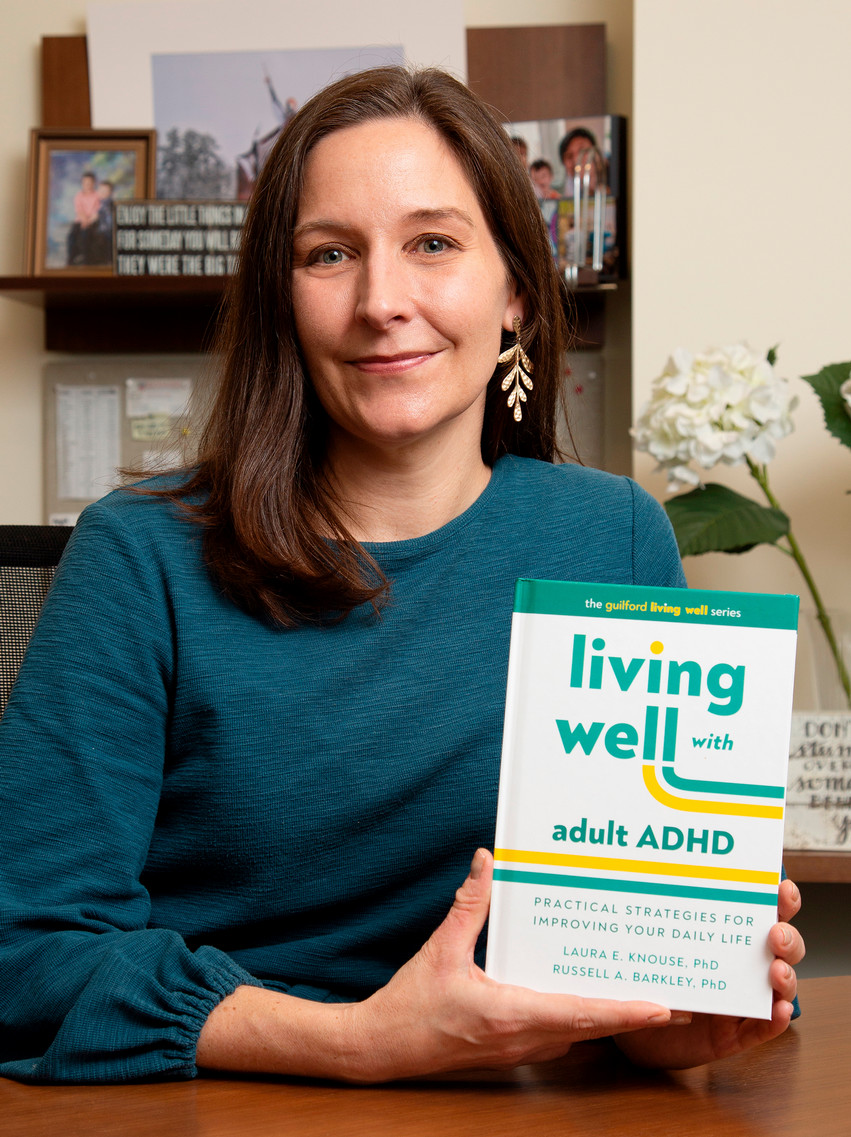 Laura Knouse with her book, 