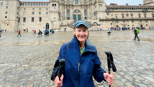 Jane Pope Rigot, W’73 stands in front of a cathedral on the Camino de Santiago.