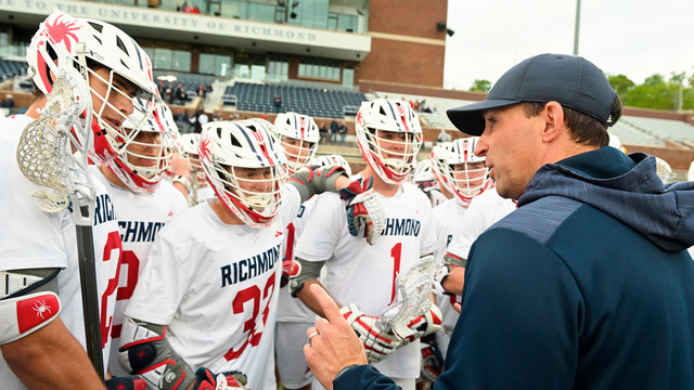 Men's lacrosse coach Dan Chemotti talks with his team at Robins Stadium