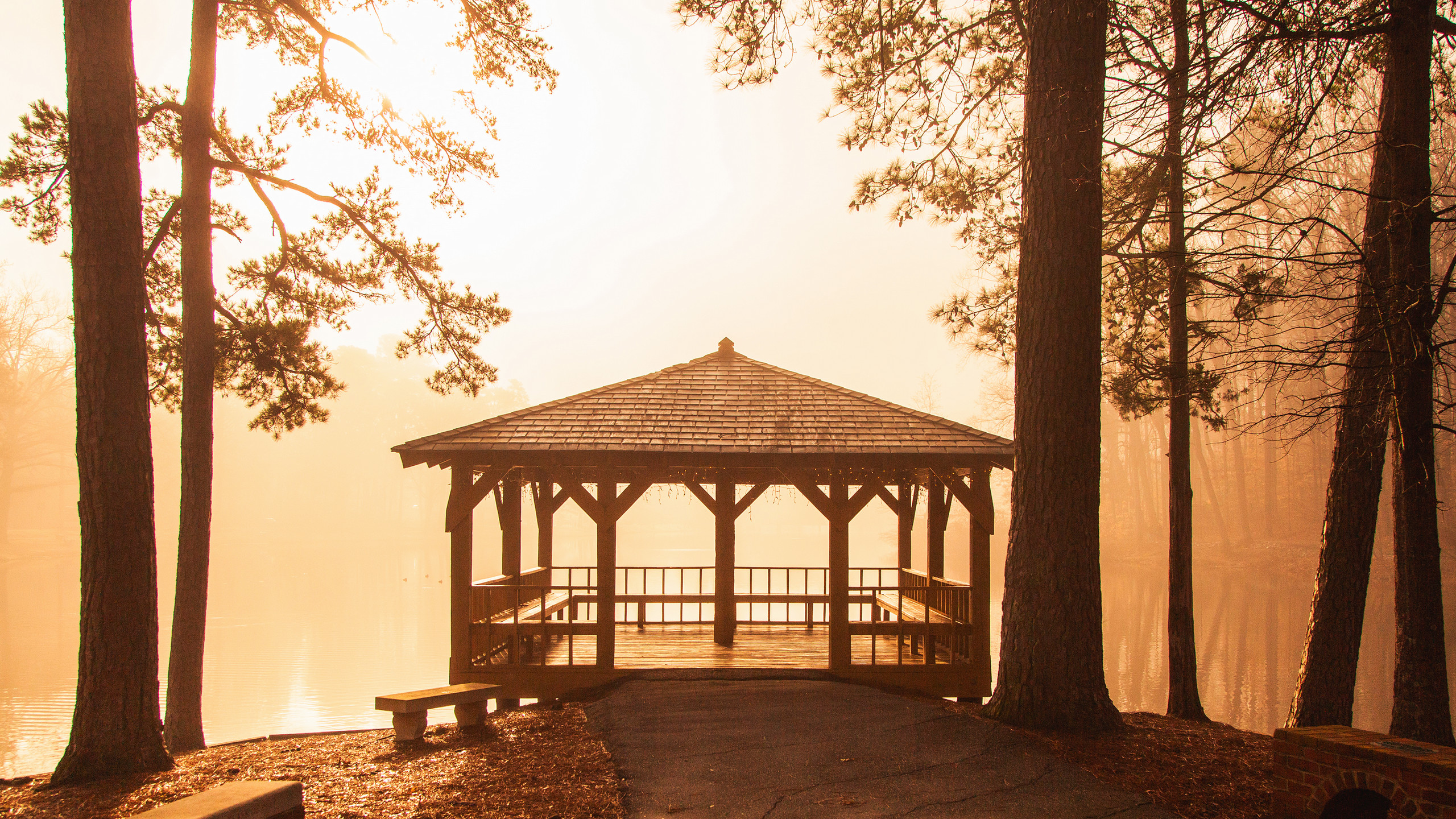 Gazebo and Westhampton Lake in warm foggy sunrise
