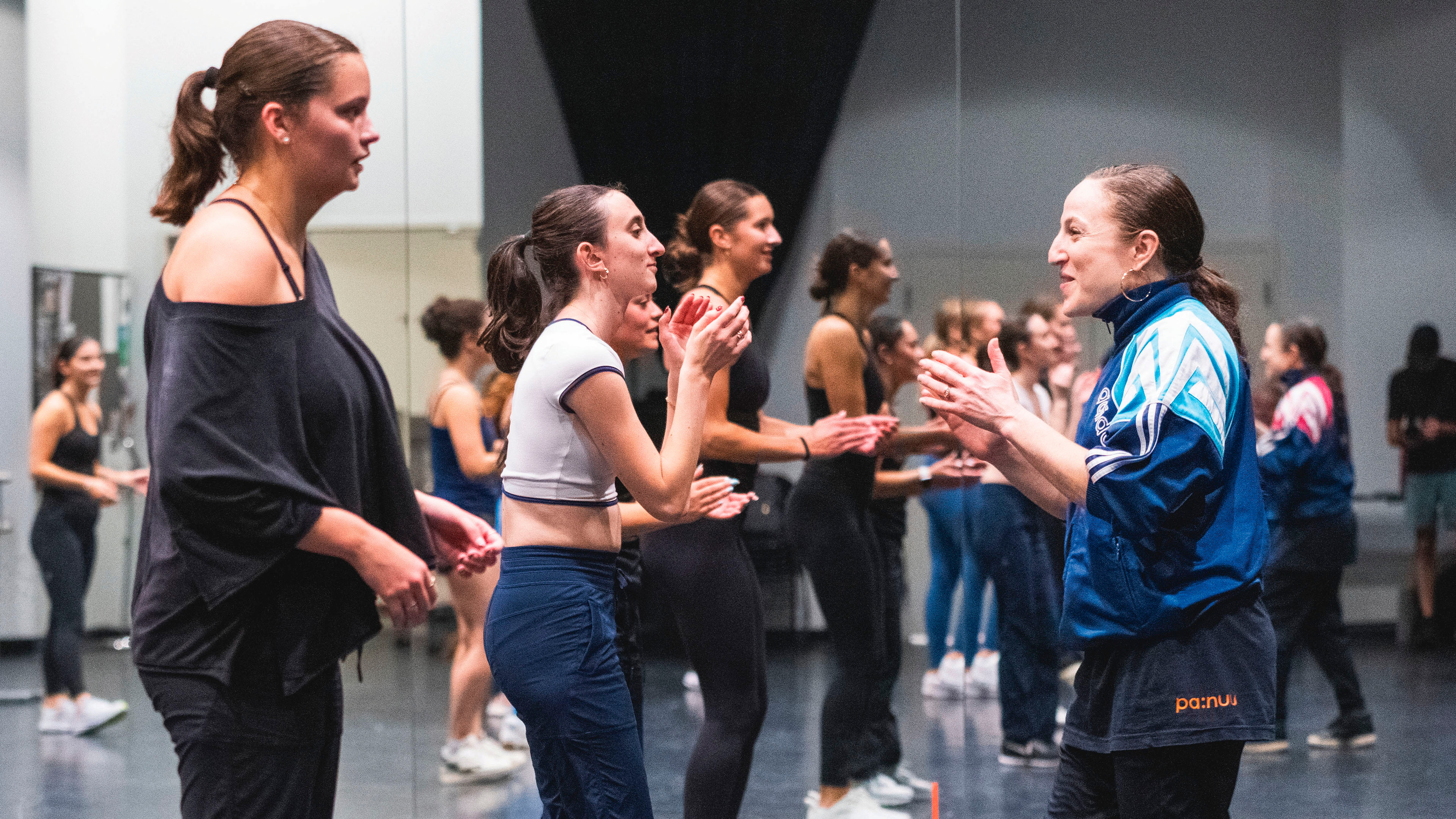 Ephrat Asherie practices with students in the dance studio.