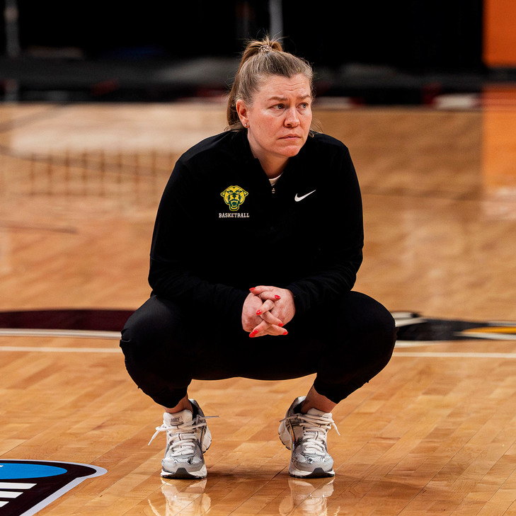 Women's basketball coach Alisa Kresge on the court during the NCAA tournament