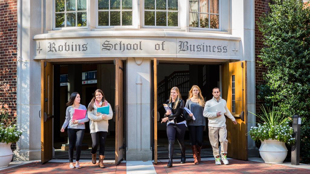 students walking out of the robins school of business