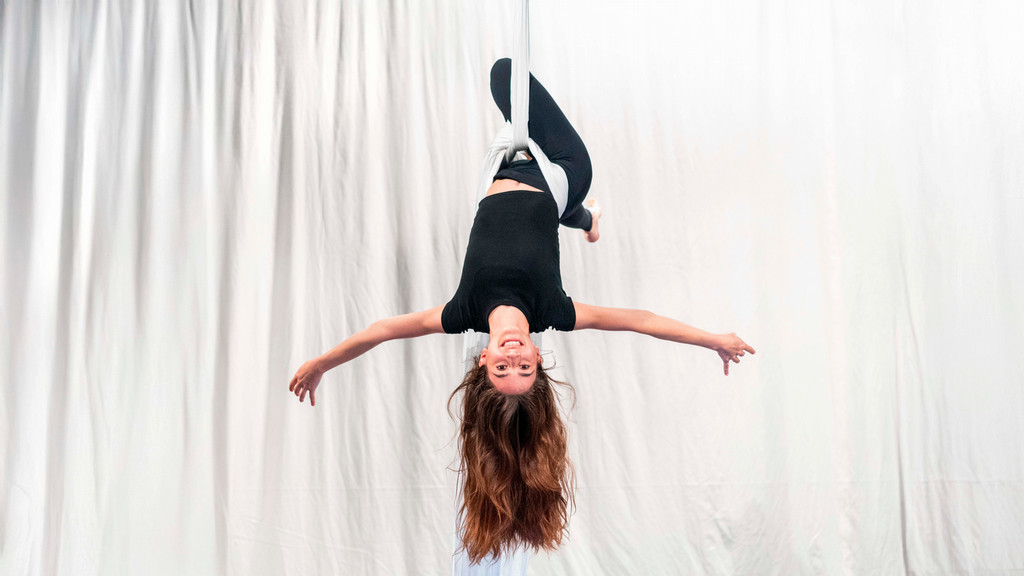 A student performs aerial dance at the A&S Student Symposium