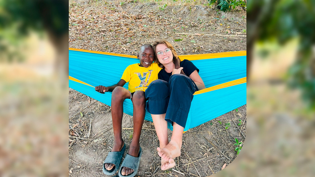 2023 UR alum Julia Brittain with her host brother in the Peace Corps