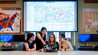 Biology professor Melinda Yang and geography professor Stephanie Spera with students