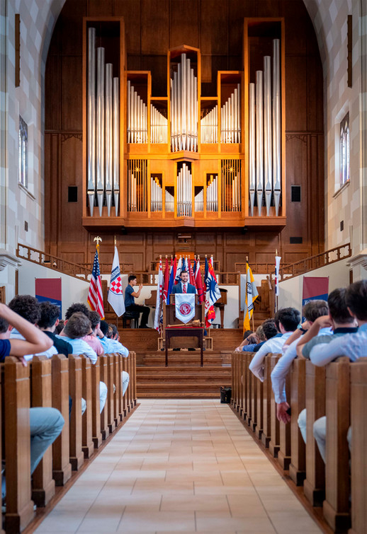 Center aisle of Cannon Memorial Chapel looking toward podium during Investiture 2026