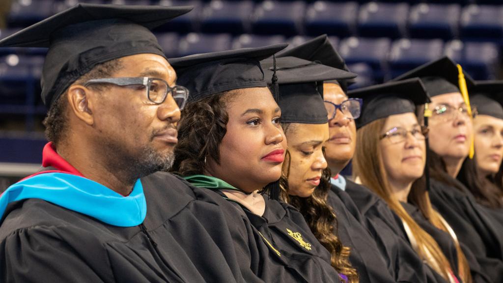 Graduates in regalia at Commencement