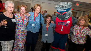Osher members photographed with UR Spiders mascot WebstUR