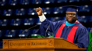 Tavorise Marks speaking at the University of Richmond podium during SPCS Commencement