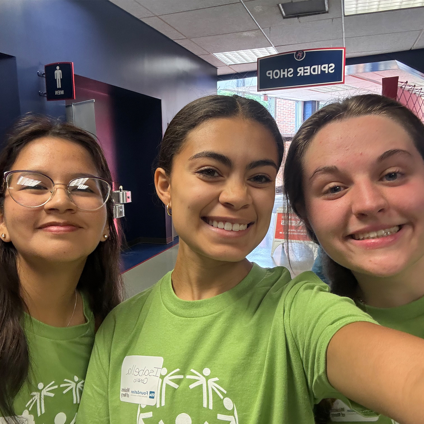 students volunteering with Special Olympics  Isabella Castillo, '26, Catherine Ercilla, '26, and Julia Gulledge, '28