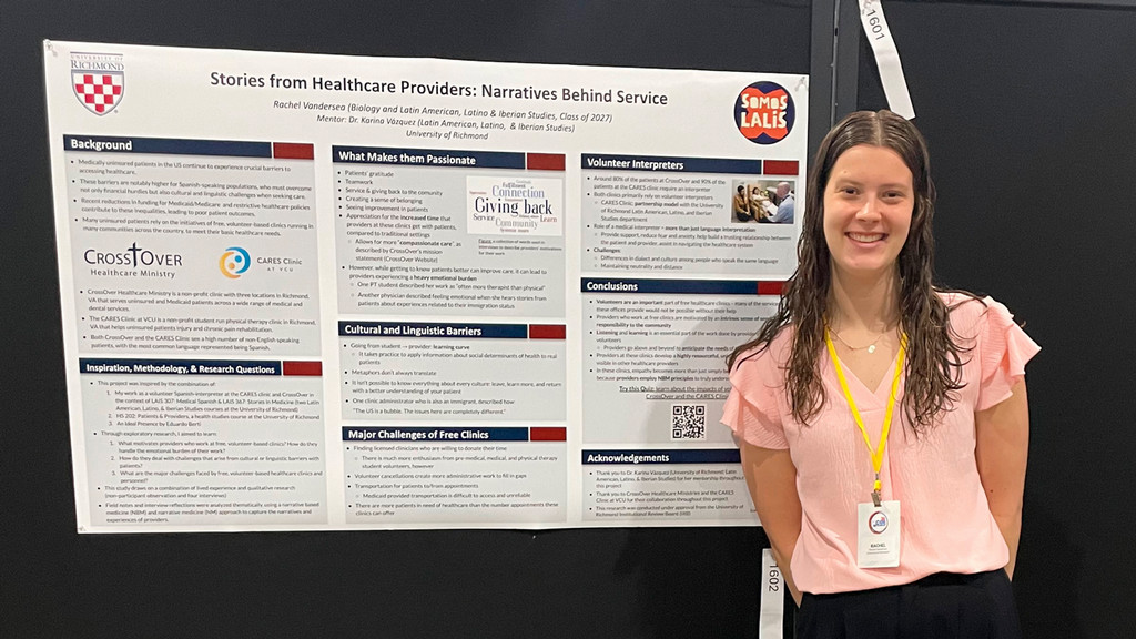 Student Rachel Vandersea in front of her research poster titled "Stories from Healthcare Providers: Narratives Behind Service."
