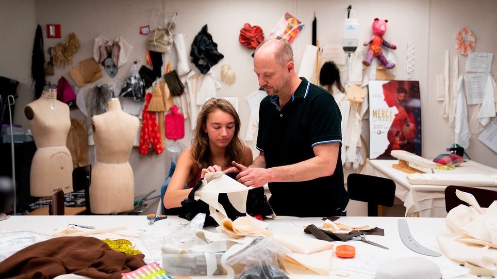 professor and student work together on costume design