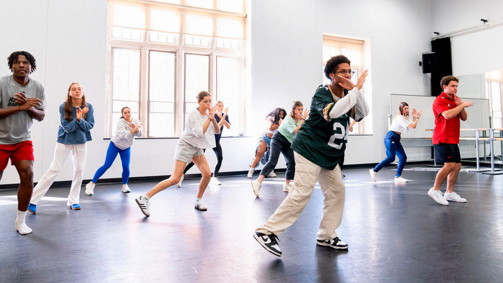 UR students participate in a community dance class in a rehearsal studio
