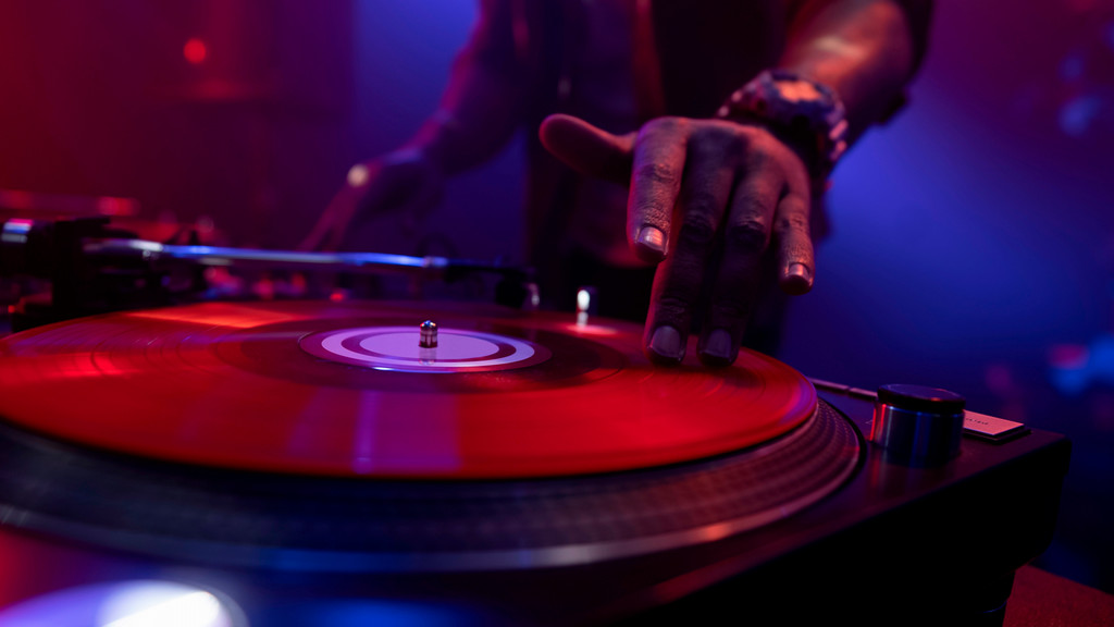 hip hop dj's hand on the turntable to spin a record