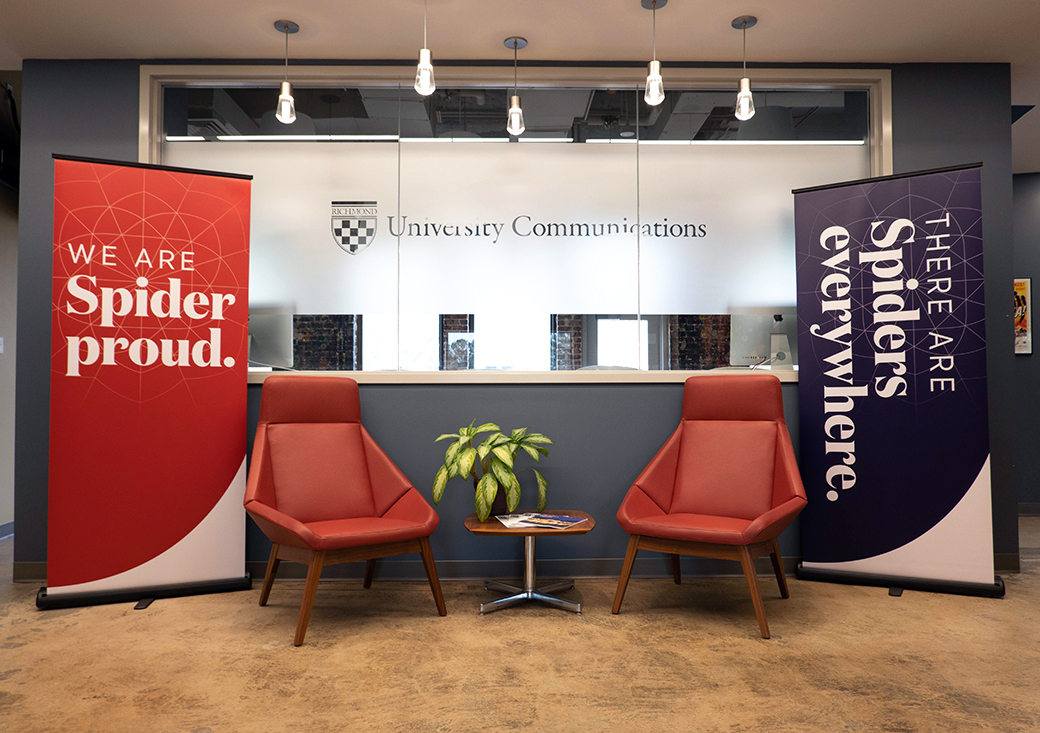 Two campus banner-ups. One that says, "We are Spider proud" and one that says, "There are spiders everywhere."