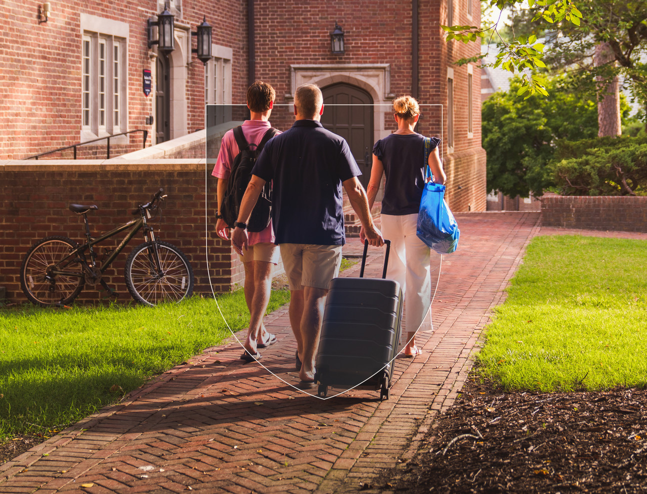 Students walking with parents on campus